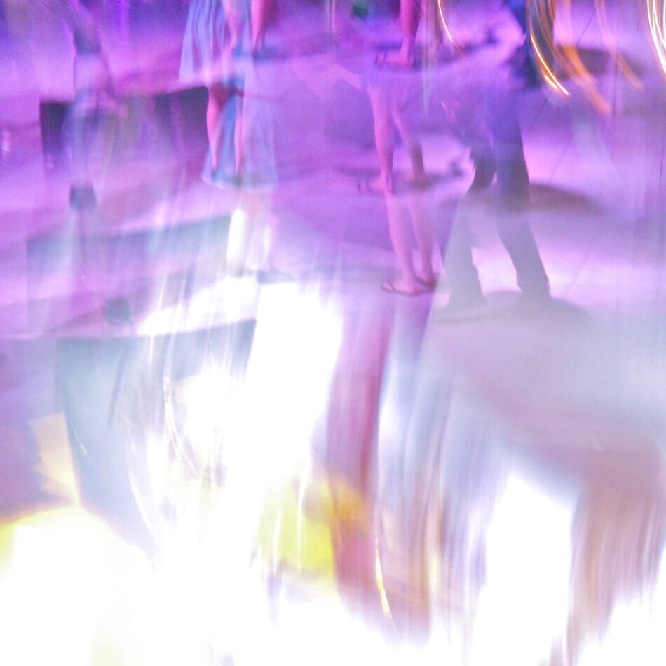 A blurry image of purple and white colors.